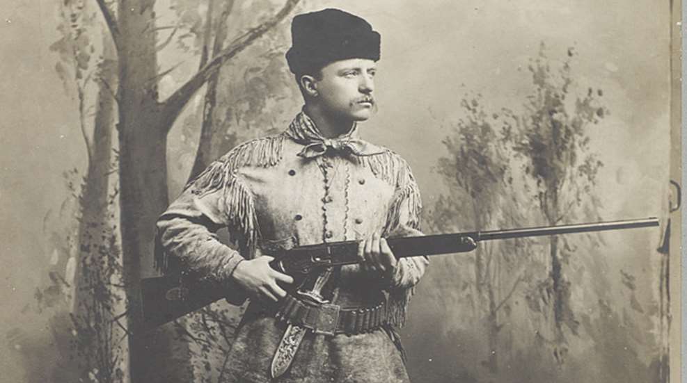teddy roosevelt holding customized Winchester Model 1876